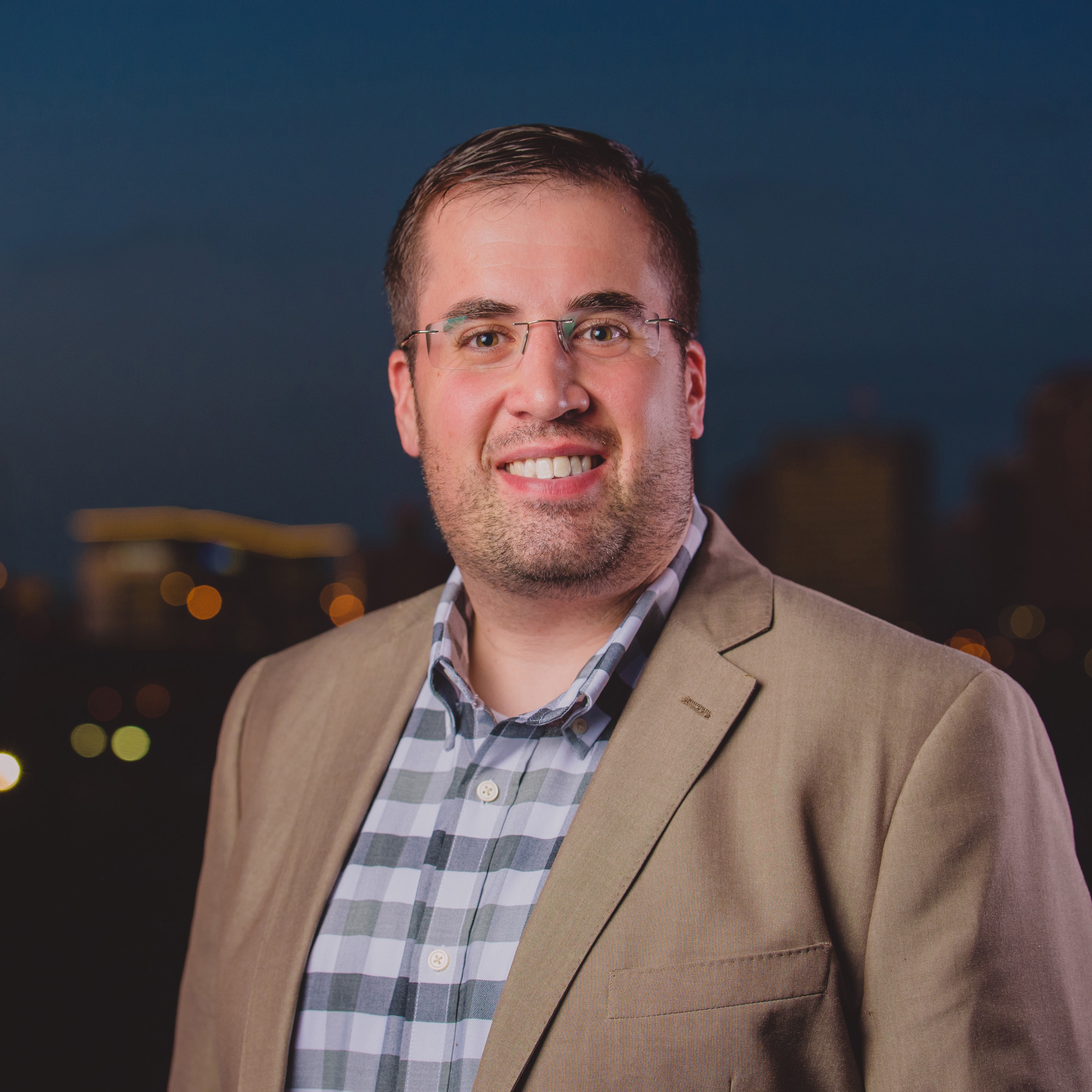 Headshot of me with Richmond, VA skyline in the bakground.